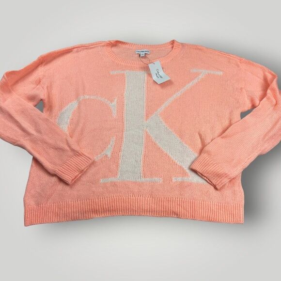 NWT Calvin Klein Women’s M Peach Oversized Sweater CK Logo Front Long Sleeve - Picture 1 of 9